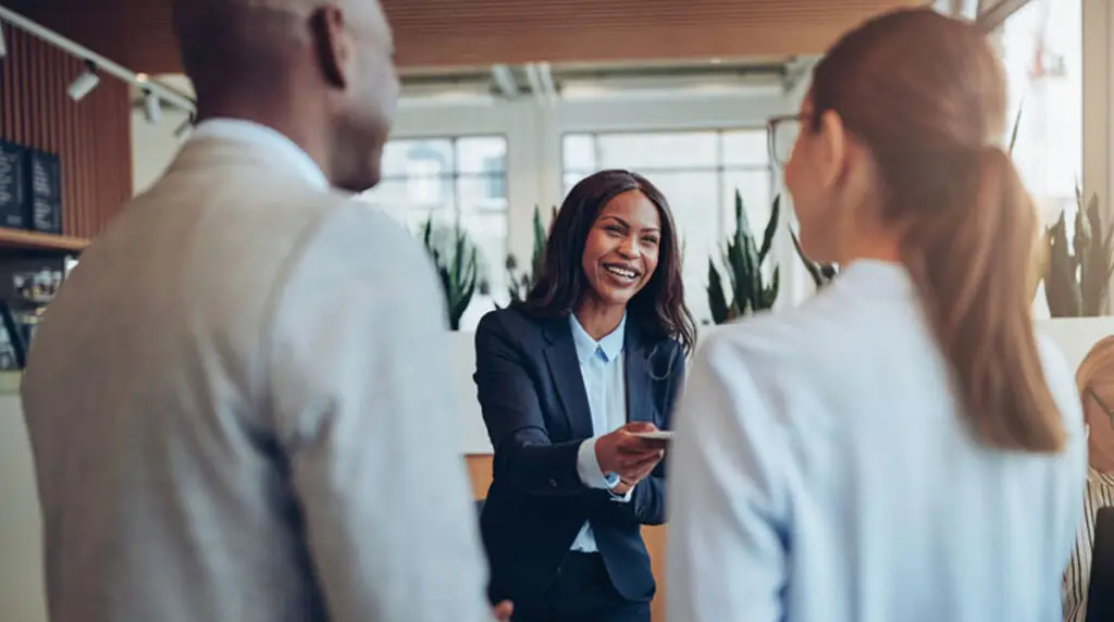 Someone greeting guests at a hotel, hospitality.